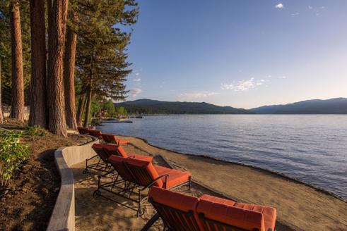 Lounge chairs on a lake beach