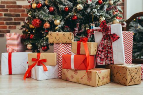 Wrapped presents beneath a Christmas tree