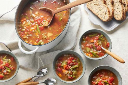 Assorted bowls of soup.