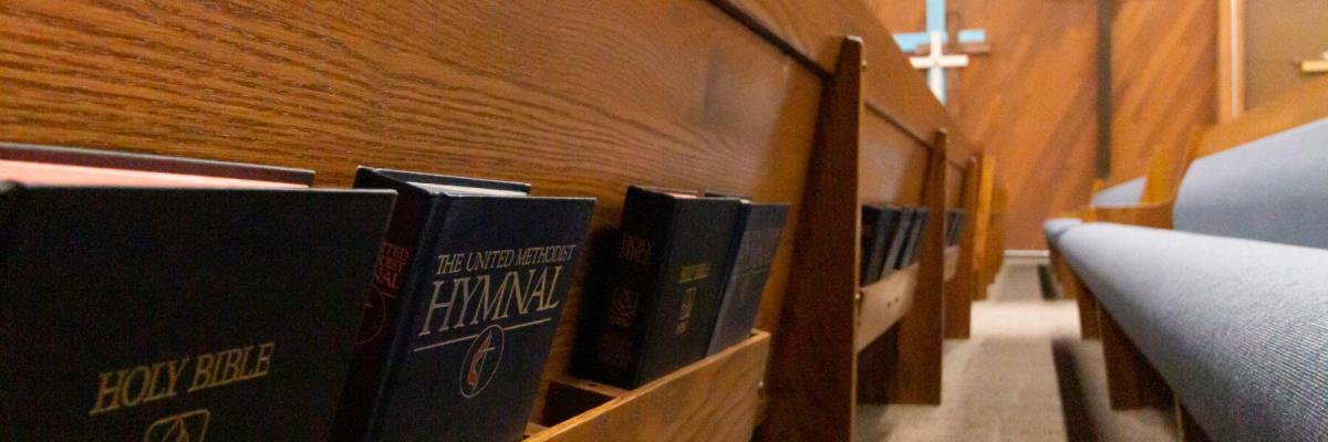 MUMC Sanctuary, back side of pews with Holy Bible and Book of Hymns
